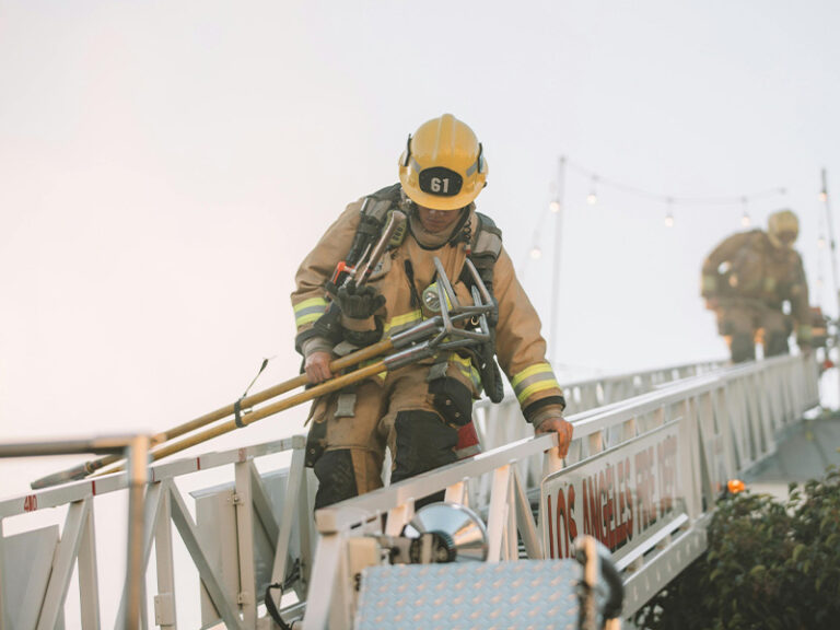 Quality Glass Block - Fire Rated Glass Block Windows - Firefighter climbing down ladder photo by Spencer Davis